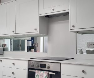 Mirrored glass splashback in a modern kitchen